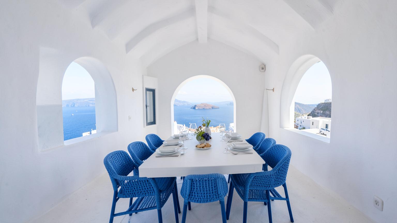 Long dining table set for eight under a white pergola at sunset